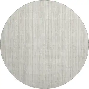 Photo of 8' Ivory And Beige Striped Washable Round Rug With UV Protection
