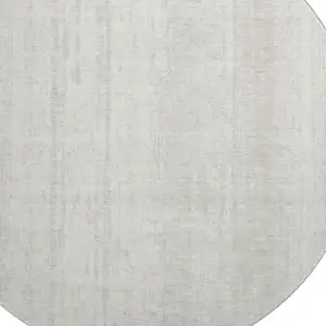 Photo of 8' Ivory And Beige Striped Washable Round Rug With UV Protection