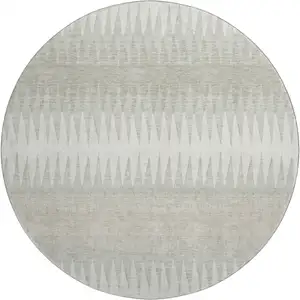Photo of 8' Ivory And Beige Striped Washable Round Rug With UV Protection