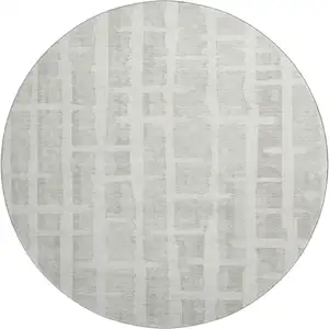 Photo of 8' Ivory And Beige Striped Washable Round Rug With UV Protection