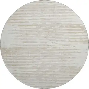 Photo of 8' Ivory And Beige Striped Washable Round Rug With UV Protection