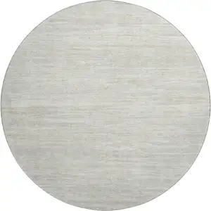 Photo of 8' Ivory And Beige Striped Washable Round Rug With UV Protection