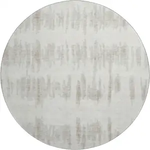 Photo of 8' Ivory And Beige Striped Washable Round Rug With UV Protection
