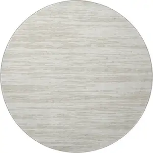 Photo of 8' Ivory And Beige Striped Washable Round Rug With UV Protection