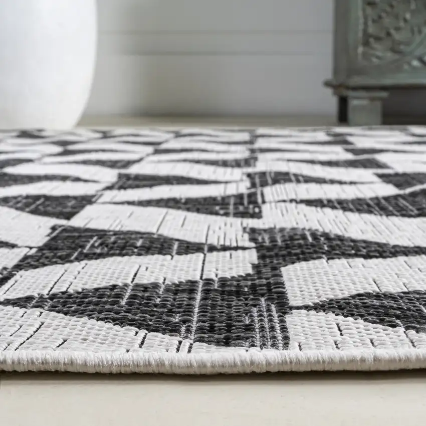 10' Ivory And Black Geometric Indoor Outdoor Runner Rug Photo 8