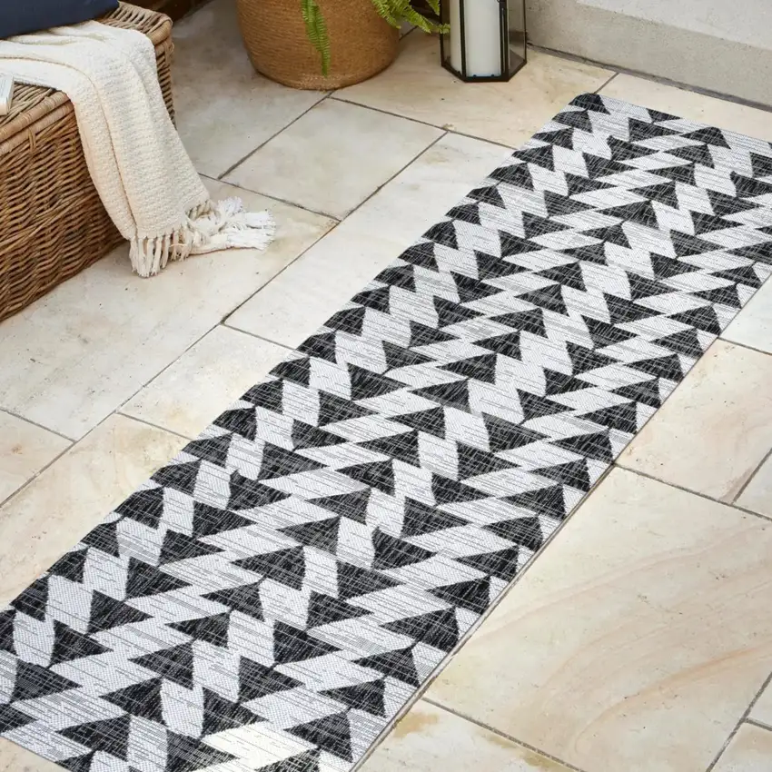 8' Ivory And Black Geometric Indoor Outdoor Runner Rug Photo 5