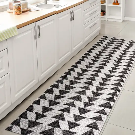 8' Ivory And Black Geometric Indoor Outdoor Runner Rug Photo 6