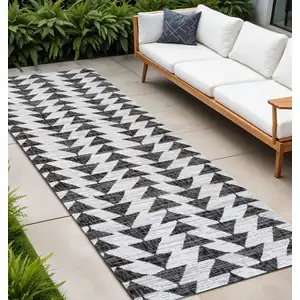 Photo of 8' Ivory And Black Geometric Indoor Outdoor Runner Rug