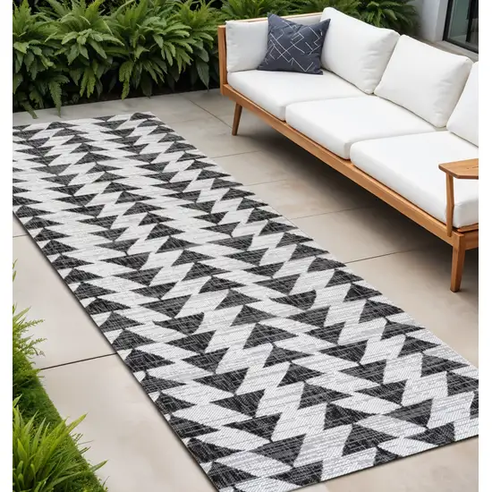 8' Ivory And Black Geometric Indoor Outdoor Runner Rug Photo 1