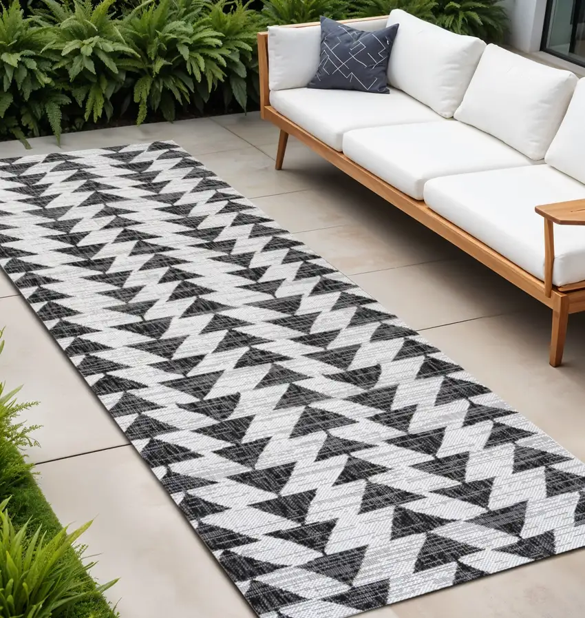 8' Ivory And Black Geometric Indoor Outdoor Runner Rug Photo 1