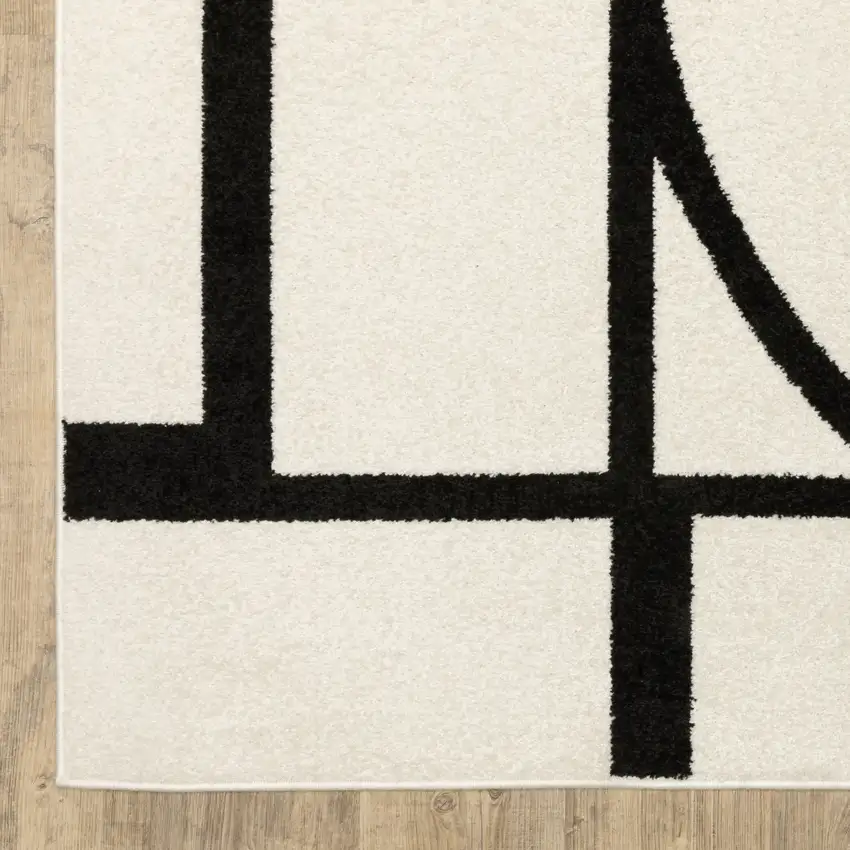 7' Ivory And Black Geometric Runner Rug Photo 7