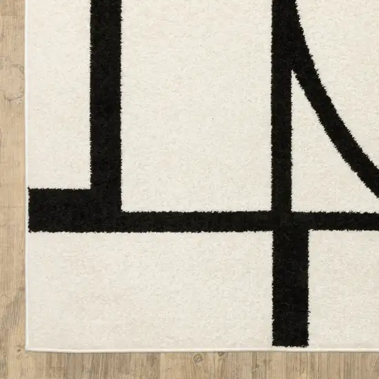 7' Ivory And Black Geometric Runner Rug Photo 7