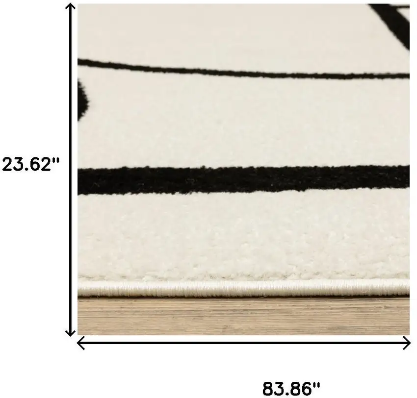 7' Ivory And Black Geometric Runner Rug Photo 9