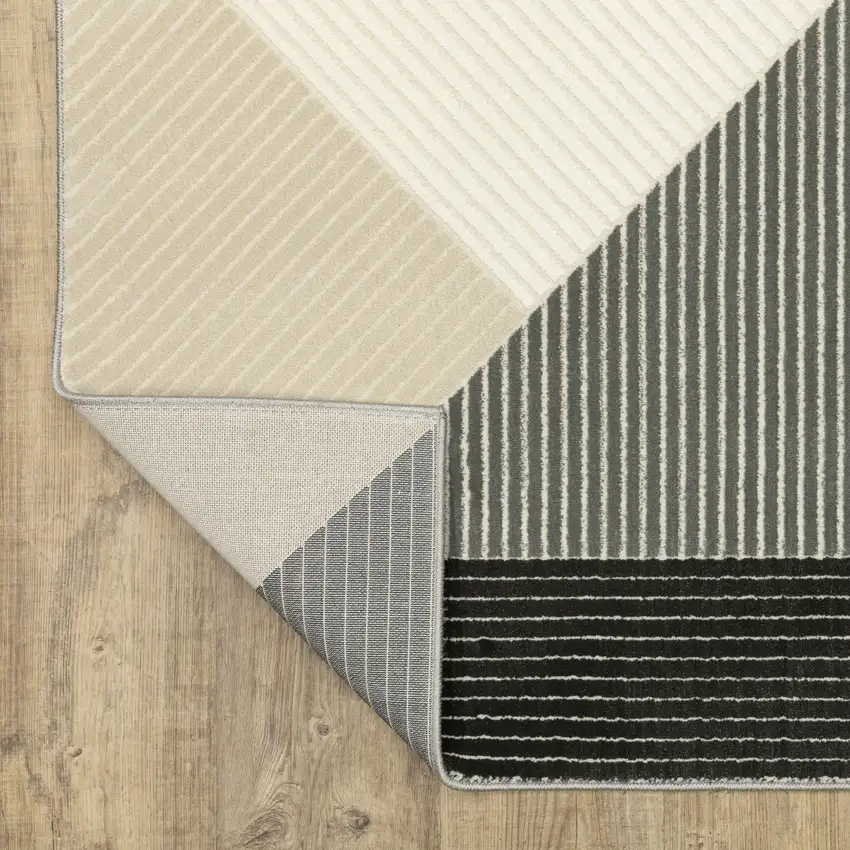 8' Ivory And Black Geometric Runner Rug Photo 9
