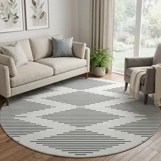 8' Ivory And Black Geometric Washable Round Rug With UV Protection Photo 1