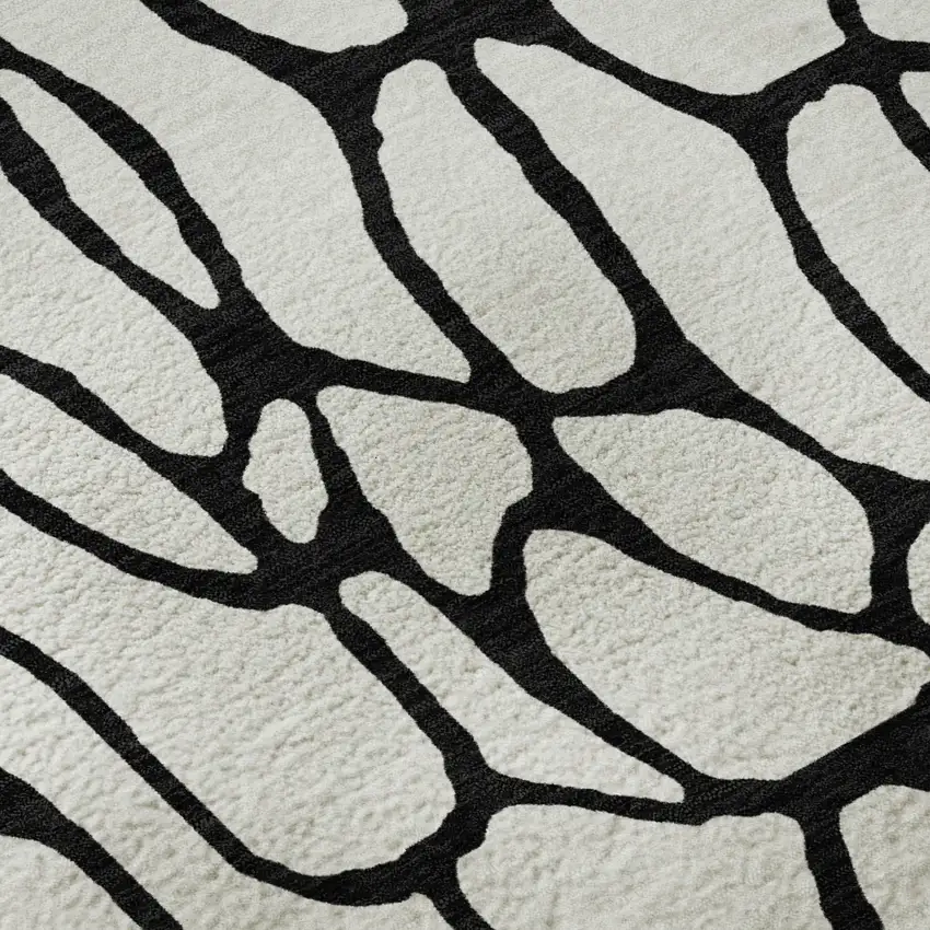 8' Ivory And Black Geometric Washable Round Rug With UV Protection Photo 8