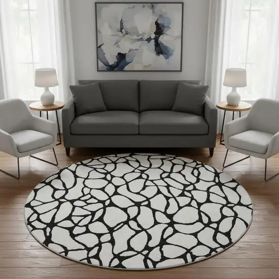 8' Ivory And Black Geometric Washable Round Rug With UV Protection Photo 2