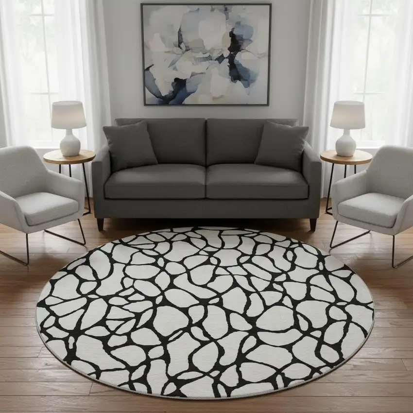 8' Ivory And Black Geometric Washable Round Rug With UV Protection Photo 2