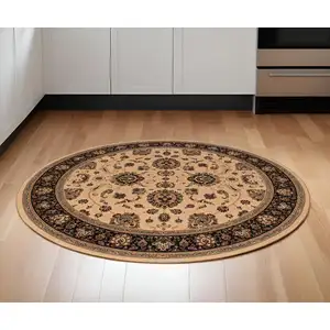 Photo of 6' Ivory And Black Oriental Round Rug
