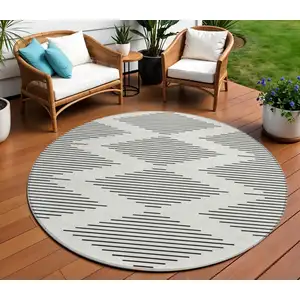 Photo of 8' Ivory And Black Round Geometric Washable Indoor Outdoor Area Rug