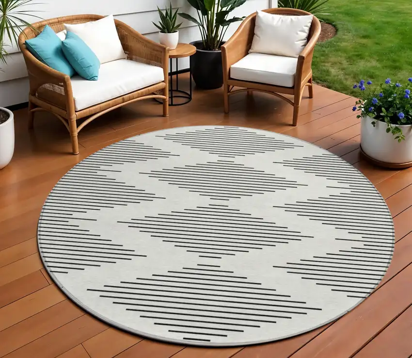 8' Ivory And Black Round Geometric Washable Indoor Outdoor Area Rug Photo 1