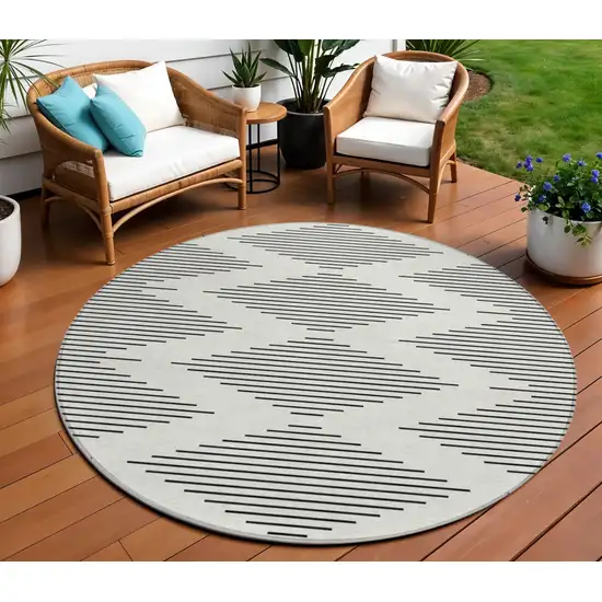 8' Ivory And Black Round Geometric Washable Indoor Outdoor Area Rug Photo 1