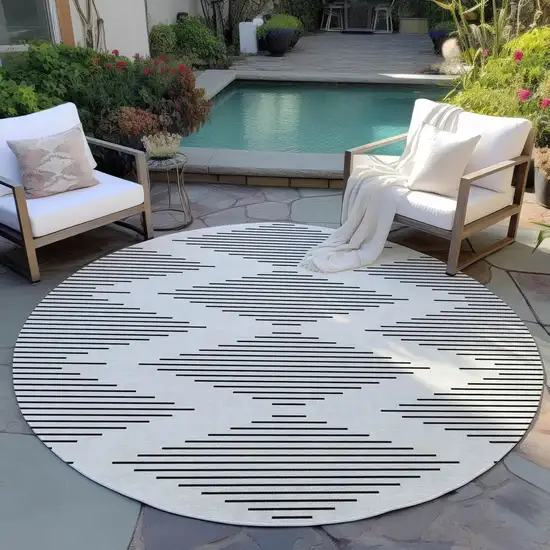 8' Ivory And Black Round Geometric Washable Indoor Outdoor Area Rug Photo 5
