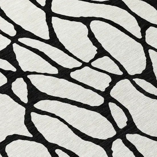 8' Ivory And Black Round Geometric Washable Indoor Outdoor Area Rug Photo 8