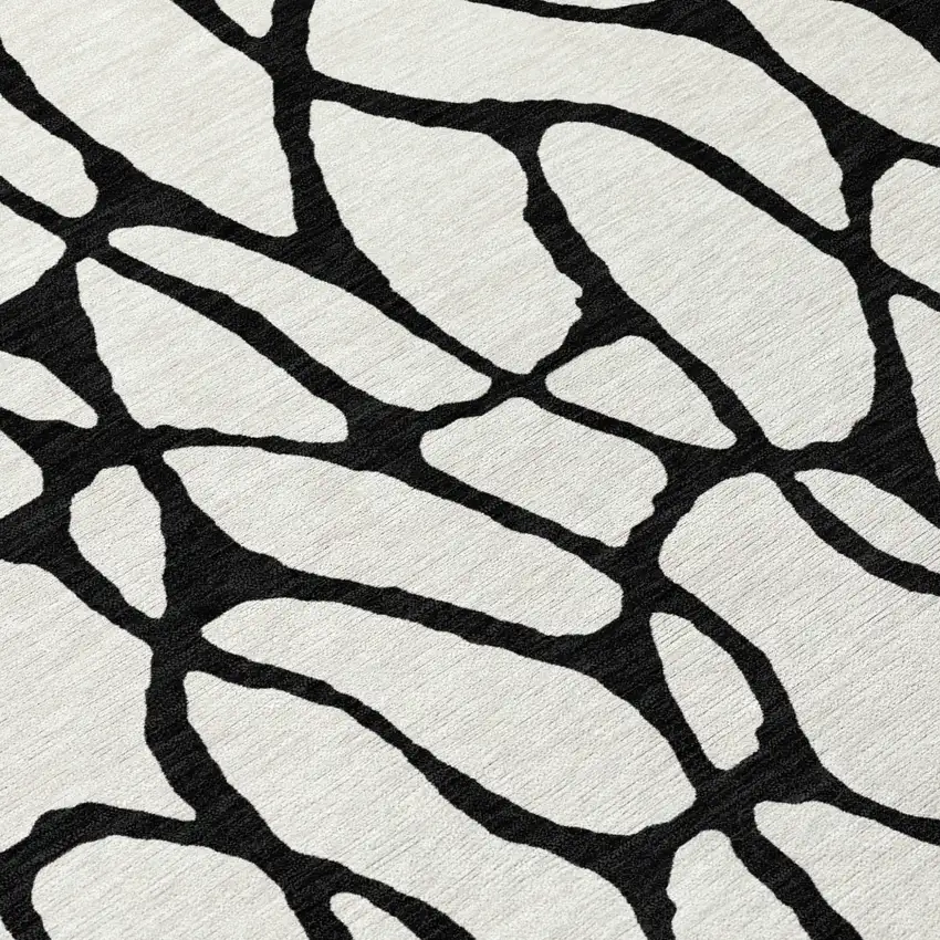 8' Ivory And Black Round Geometric Washable Indoor Outdoor Area Rug Photo 8