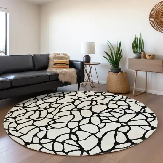 8' Ivory And Black Round Geometric Washable Indoor Outdoor Area Rug Photo 7