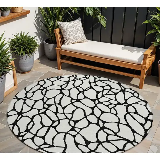8' Ivory And Black Round Geometric Washable Indoor Outdoor Area Rug Photo 1