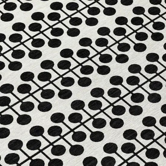 8' Ivory And Black Round Geometric Washable Indoor Outdoor Area Rug Photo 9