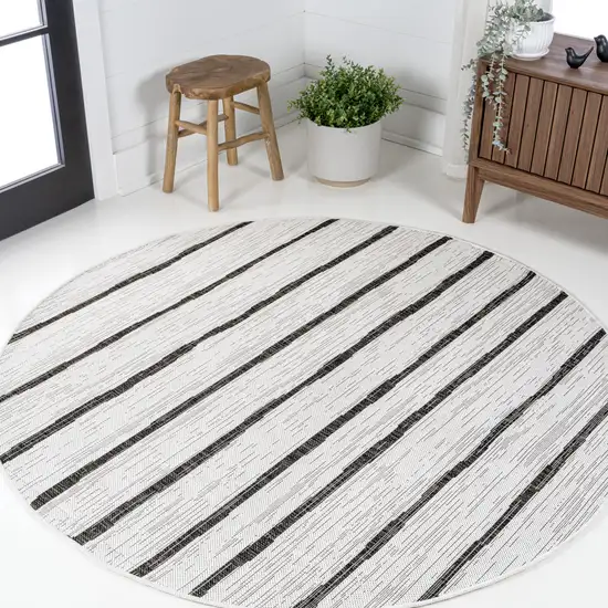 8' Ivory And Black Round Striped Indoor Outdoor Area Rug Photo 4