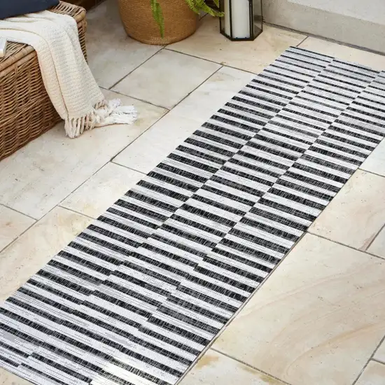 10' Ivory And Black Striped Indoor Outdoor Runner Rug Photo 5