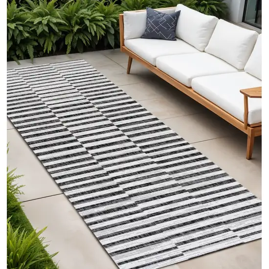 8' Ivory And Black Striped Indoor Outdoor Runner Rug Photo 1