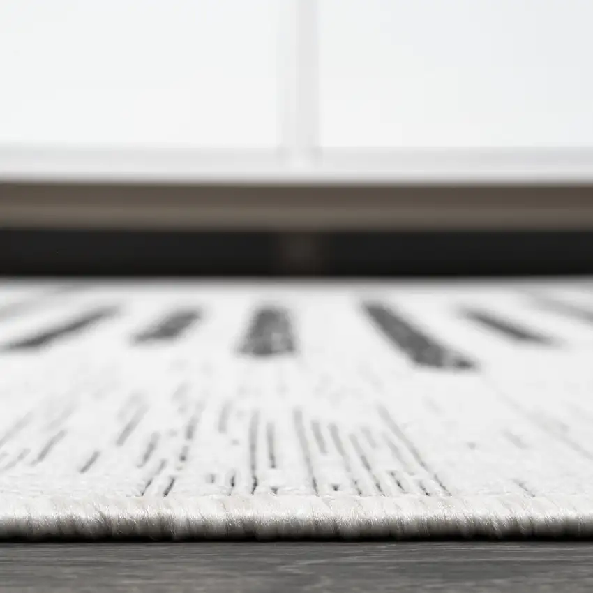 10' Ivory And Black Striped Indoor Outdoor Runner Rug Photo 7