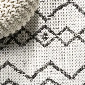 Photo of 10' Ivory And Black Trellis Indoor Outdoor Runner Rug