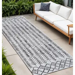 Photo of 10' Ivory And Black Trellis Indoor Outdoor Runner Rug