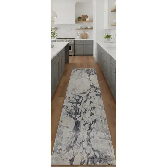 8' Ivory And Blue Abstract Power Loom Distressed Runner Rug Photo 1