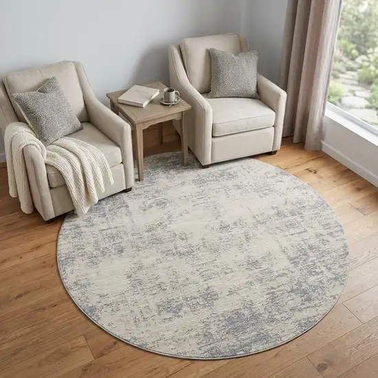 6' Ivory And Blue Abstract Round Rug Photo 1