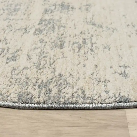 6' Ivory And Blue Abstract Round Rug Photo 3