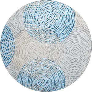Photo of 8' Ivory And Blue Abstract Washable Round Rug With UV Protection