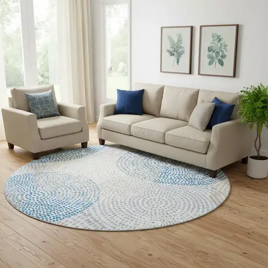 8' Ivory And Blue Abstract Washable Round Rug With UV Protection Photo 1