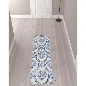 Photo of 8' Ivory And Blue Damask Distressed Runner Rug