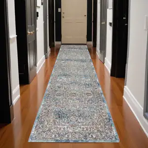 Photo of 10' Ivory And Blue Floral Distressed Runner Rug