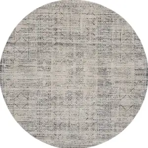 Photo of 8' Ivory And Blue Geometric Distressed Round Rug With Fringe