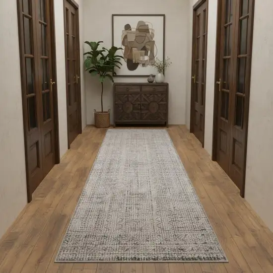 10' Ivory And Blue Geometric Distressed Runner Rug With Fringe Photo 1