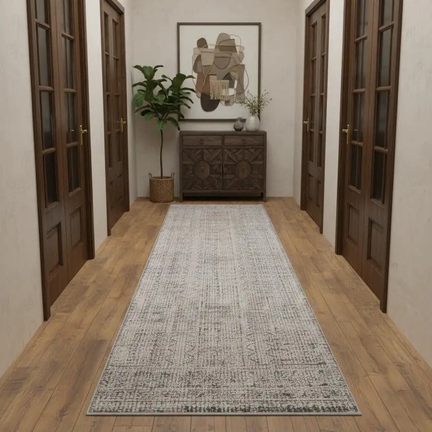 10' Ivory And Blue Geometric Distressed Runner Rug With Fringe Photo 1