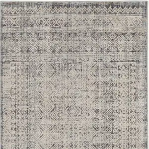 Photo of 10' Ivory And Blue Geometric Distressed Runner Rug With Fringe