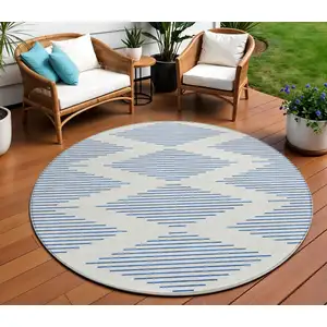 Photo of 8' Ivory And Blue Round Geometric Washable Indoor Outdoor Area Rug
